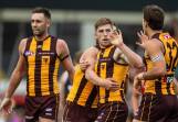 Dylan Moore (centre) celebrates a goal during Hawthorn's five-point win over St Kilda. (Linda Higginson/AAP PHOTOS)